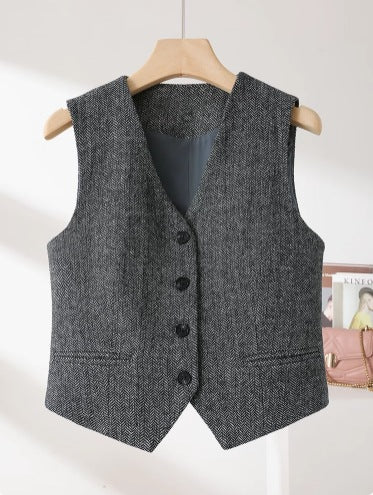An “old money” vest captures the essence of quiet luxury through its timeless tailoring and understated elegance.