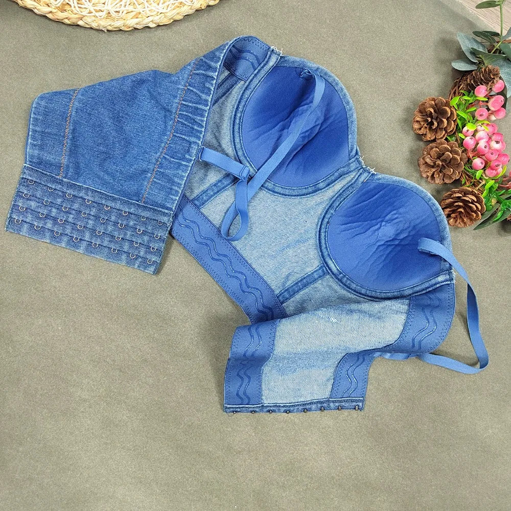 A denim corset with hanging rhinestones strikes a bold balance between rugged edge and high-glam allure. The structured denim hugs the body, giving it that classic, sculpted silhouette, while the cascading rhinestones add mov