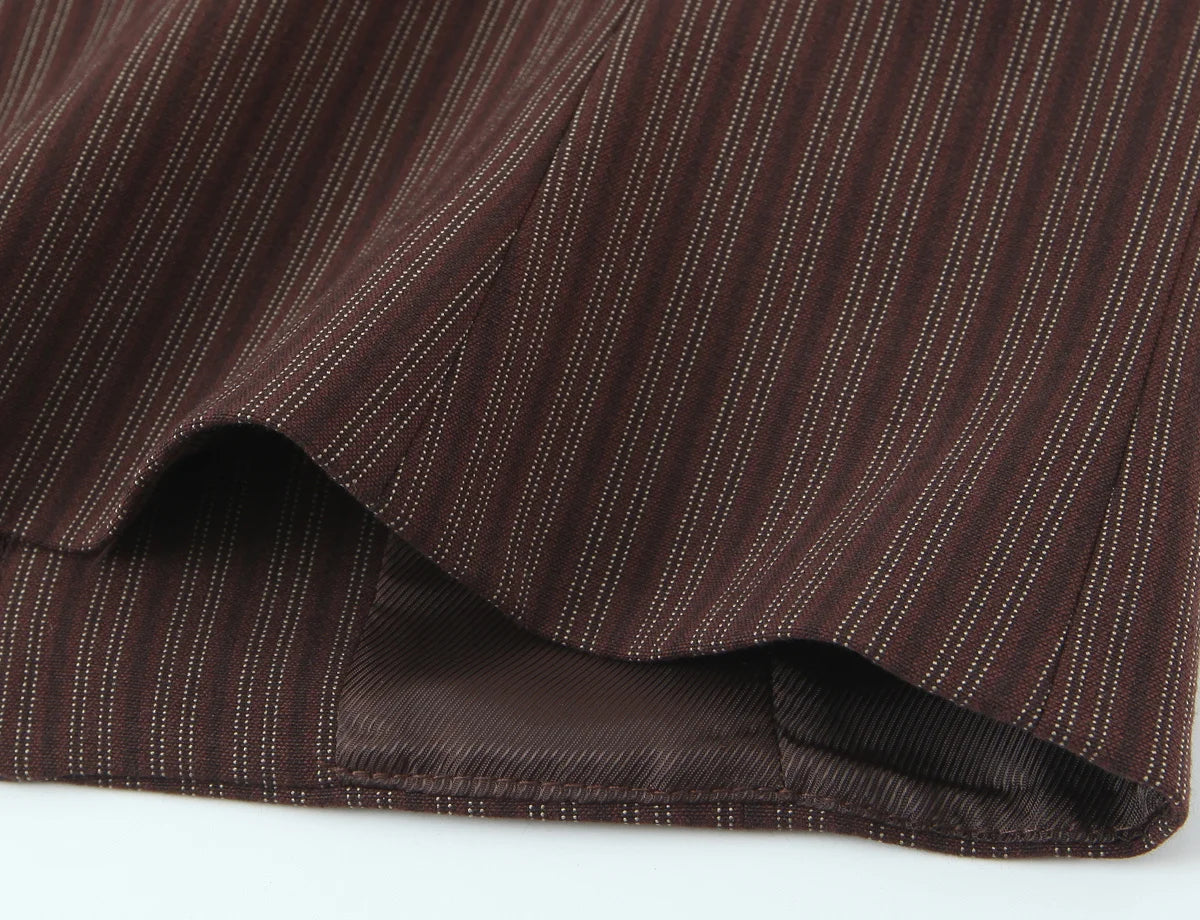 A brown vest paired with high-waisted brown pants creates a sleek, monochromatic look that feels both polished and effortlessly refined. The vest adds a tailored, structured edge—especially when worn fitted or slightly crop