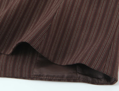 A brown vest paired with high-waisted brown pants creates a sleek, monochromatic look that feels both polished and effortlessly refined. The vest adds a tailored, structured edge—especially when worn fitted or slightly crop