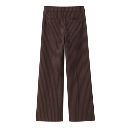 A brown vest paired with high-waisted brown pants creates a sleek, monochromatic look that feels both polished and effortlessly refined. The vest adds a tailored, structured edge—especially when worn fitted or slightly crop