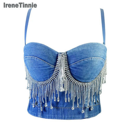 A denim corset with hanging rhinestones strikes a bold balance between rugged edge and high-glam allure. The structured denim hugs the body, giving it that classic, sculpted silhouette, while the cascading rhinestones add mov