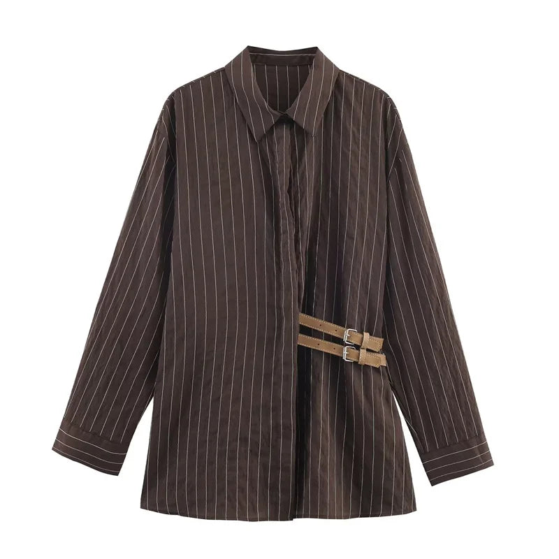 A women’s brown shirt in the “old money” aesthetic embodies quiet luxury and understated refinement. Typically crafted from high-quality fabrics like silk, fine cotton, or linen, it features a clean, tailored silhouette