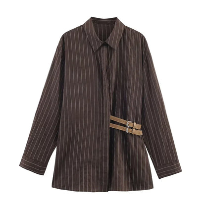 A women’s brown shirt in the “old money” aesthetic embodies quiet luxury and understated refinement. Typically crafted from high-quality fabrics like silk, fine cotton, or linen, it features a clean, tailored silhouette