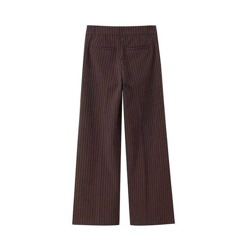 A brown vest paired with high-waisted brown pants creates a sleek, monochromatic look that feels both polished and effortlessly refined. The vest adds a tailored, structured edge—especially when worn fitted or slightly crop