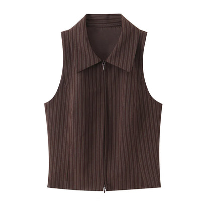 A brown vest paired with high-waisted brown pants creates a sleek, monochromatic look that feels both polished and effortlessly refined. The vest adds a tailored, structured edge—especially when worn fitted or slightly crop