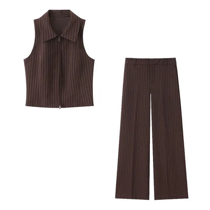 A brown vest paired with high-waisted brown pants creates a sleek, monochromatic look that feels both polished and effortlessly refined. The vest adds a tailored, structured edge—especially when worn fitted or slightly crop