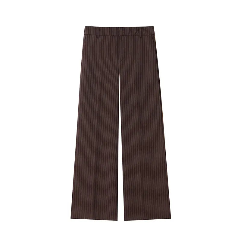 A brown vest paired with high-waisted brown pants creates a sleek, monochromatic look that feels both polished and effortlessly refined. The vest adds a tailored, structured edge—especially when worn fitted or slightly crop
