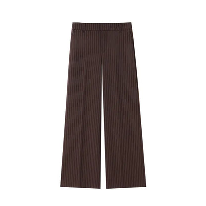 A brown vest paired with high-waisted brown pants creates a sleek, monochromatic look that feels both polished and effortlessly refined. The vest adds a tailored, structured edge—especially when worn fitted or slightly crop
