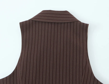 A brown vest paired with high-waisted brown pants creates a sleek, monochromatic look that feels both polished and effortlessly refined. The vest adds a tailored, structured edge—especially when worn fitted or slightly crop