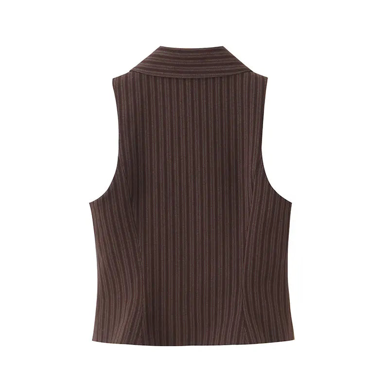 A brown vest paired with high-waisted brown pants creates a sleek, monochromatic look that feels both polished and effortlessly refined. The vest adds a tailored, structured edge—especially when worn fitted or slightly crop