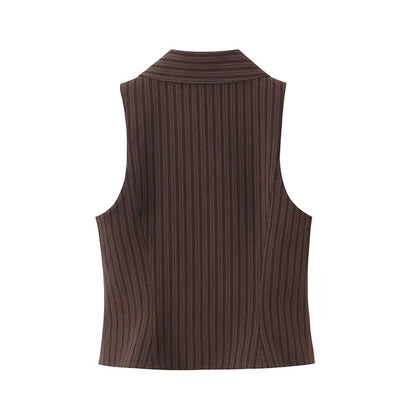 A brown vest paired with high-waisted brown pants creates a sleek, monochromatic look that feels both polished and effortlessly refined. The vest adds a tailored, structured edge—especially when worn fitted or slightly crop