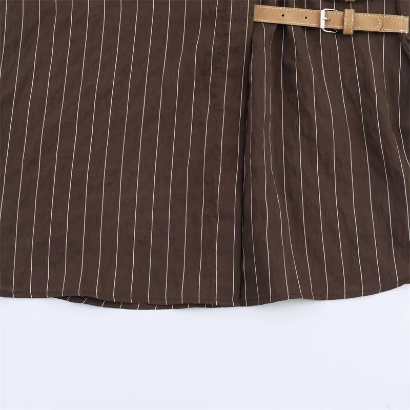 A women’s brown shirt in the “old money” aesthetic embodies quiet luxury and understated refinement. Typically crafted from high-quality fabrics like silk, fine cotton, or linen, it features a clean, tailored silhouette