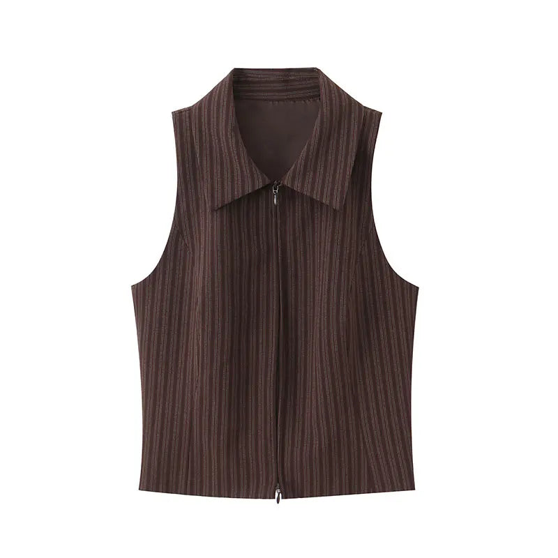 A brown vest paired with high-waisted brown pants creates a sleek, monochromatic look that feels both polished and effortlessly refined. The vest adds a tailored, structured edge—especially when worn fitted or slightly crop