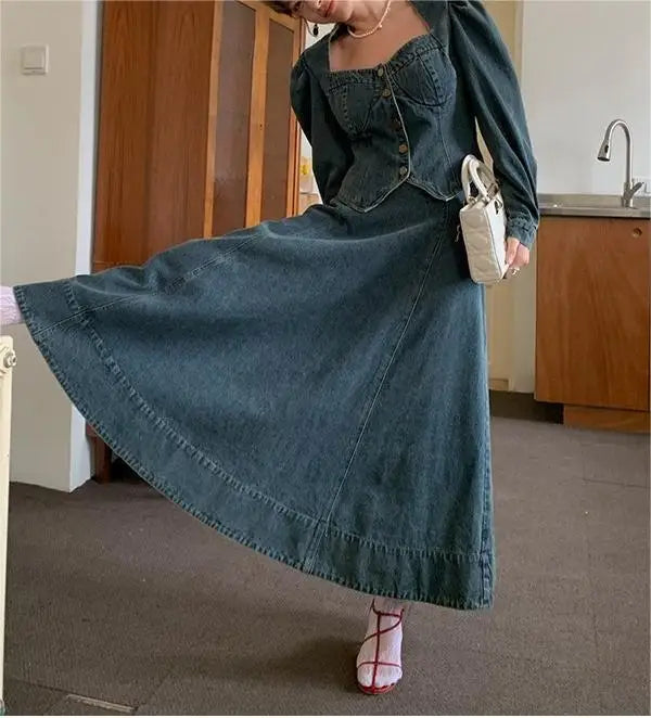 A denim top and long skirt set offers a timeless blend of effortless style and coordinated elegance. The structured denim top adds a flattering, tailored touch, while the flowing long skirt brings movement and grace, creating
