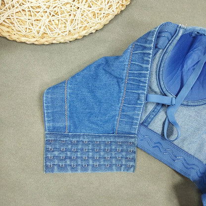 A denim corset with hanging rhinestones strikes a bold balance between rugged edge and high-glam allure. The structured denim hugs the body, giving it that classic, sculpted silhouette, while the cascading rhinestones add mov