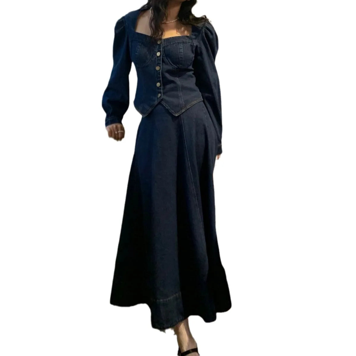 A denim top and long skirt set offers a timeless blend of effortless style and coordinated elegance. The structured denim top adds a flattering, tailored touch, while the flowing long skirt brings movement and grace, creating