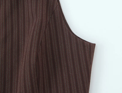 A brown vest paired with high-waisted brown pants creates a sleek, monochromatic look that feels both polished and effortlessly refined. The vest adds a tailored, structured edge—especially when worn fitted or slightly crop