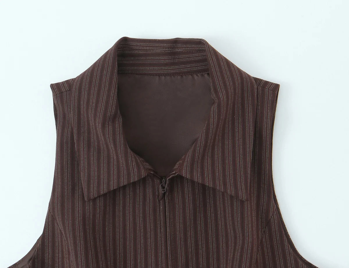 A brown vest paired with high-waisted brown pants creates a sleek, monochromatic look that feels both polished and effortlessly refined. The vest adds a tailored, structured edge—especially when worn fitted or slightly crop