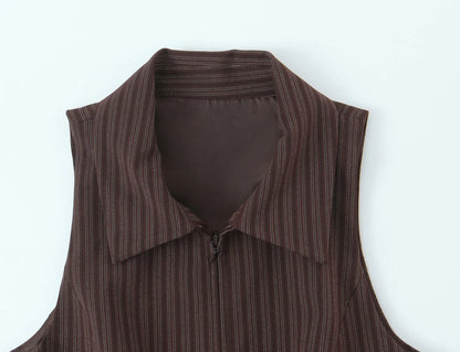A brown vest paired with high-waisted brown pants creates a sleek, monochromatic look that feels both polished and effortlessly refined. The vest adds a tailored, structured edge—especially when worn fitted or slightly crop