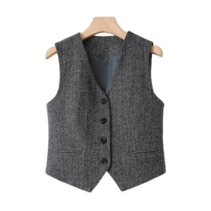 An “old money” vest captures the essence of quiet luxury through its timeless tailoring and understated elegance.