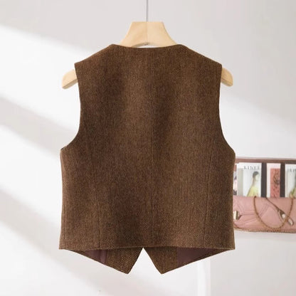 An “old money” vest captures the essence of quiet luxury through its timeless tailoring and understated elegance.