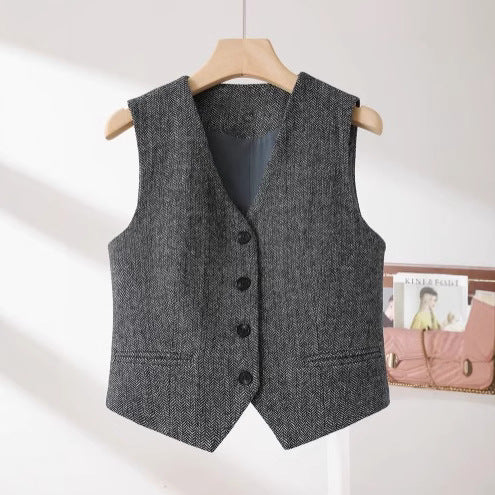 An “old money” vest captures the essence of quiet luxury through its timeless tailoring and understated elegance.
